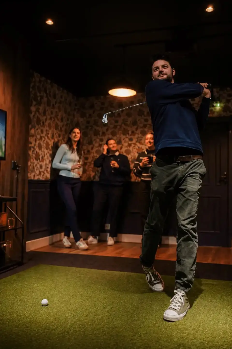 Premium indoor golf simulator at City Greens Golf in Norwich with TrackMan technology.